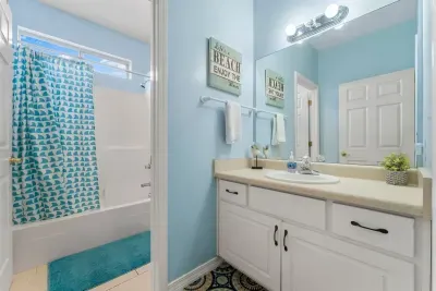 The full bathroom downstairs has a separate vanity area, which is nice for multiple family members getting ready at the same time.