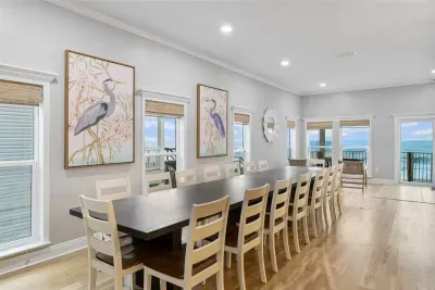 The dining area can accommodate the whole crew with two end-to-end dining tables and 16 dining chairs.