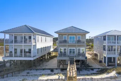 A Wave From It All is the middle home in this photo.