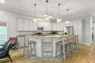 The bar area has 6 bar stools for additional seating, so the cook is never left out of the conversation.