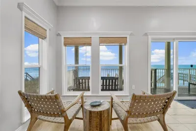 The Keeping Room is all about the beach front view! Watch and listen to the waves while while you visit with your guests.