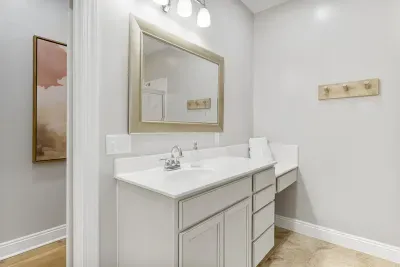 Primary suite en suite bathroom- spread out and enjoy the space! This is the first of two vanities, located in front of the walk in shower.