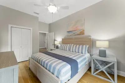 Bedroom with King Bed, Roku TV, closet, and shared back porch access.