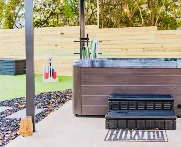 Your spa oasis awaits... Whether covered or open, the louvered pergola lets you be under the stars.