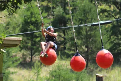 Challenge your skills in the high ropes obstacle course. 