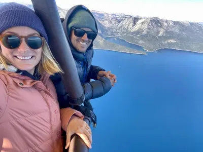 Two people taking a selfie in a hot air balloon.