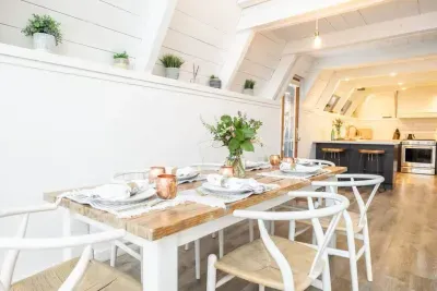 Our dining area flows perfectly to the kitchen, so the chef of the group doesn't feel left out. The door leading to the salt water spa is just visible to the left