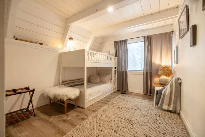 Our third bedroom features twin over twin bunks and is just opposite the lower level bathroom/laundry room