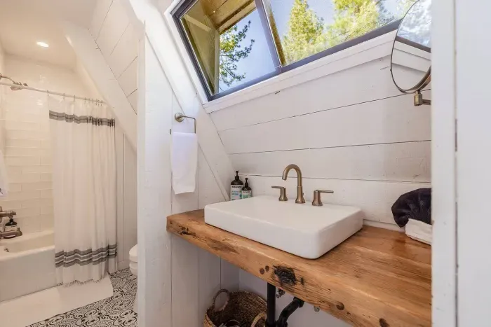 The second level bathroom is located just near the primary bedroom & loft area