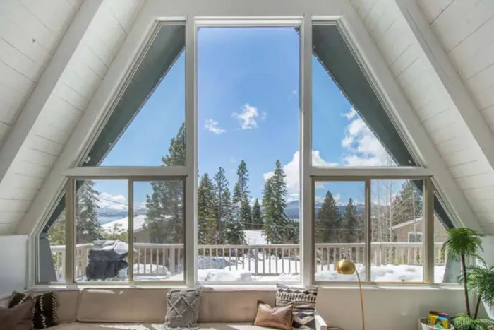 We have the best views! The largest picture window in the center now has a retractable shade + mini split installed above to keep you cool in the summer months. The smaller windows below slide open to get you the lake breeze whenever you'd like it