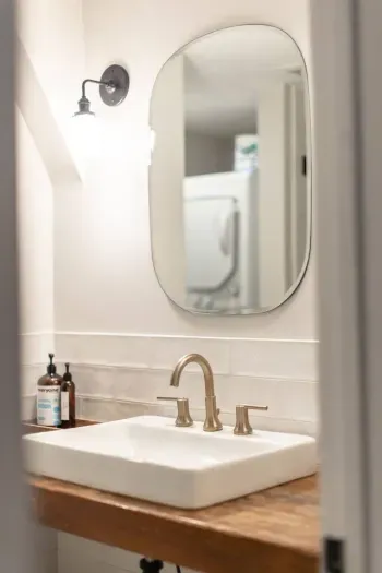 Our downstairs bath comes complete with custom vanity, large walk-in shower, toilet and stacked washer and dryer. We provide toiletries and washing detergent for your stay