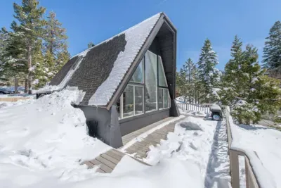 One of our more snow years, but the A frame handles it well! Our South facing orientation means the front deck gets a ton of sun and the snow usually melts here quickly!