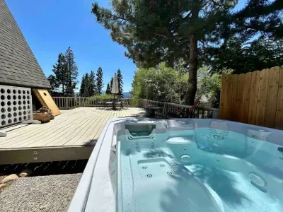 Enjoy the view towards the forest and Lake Tahoe from our Salt Water Spa! Just steps from the main living area-we provide the spa towels