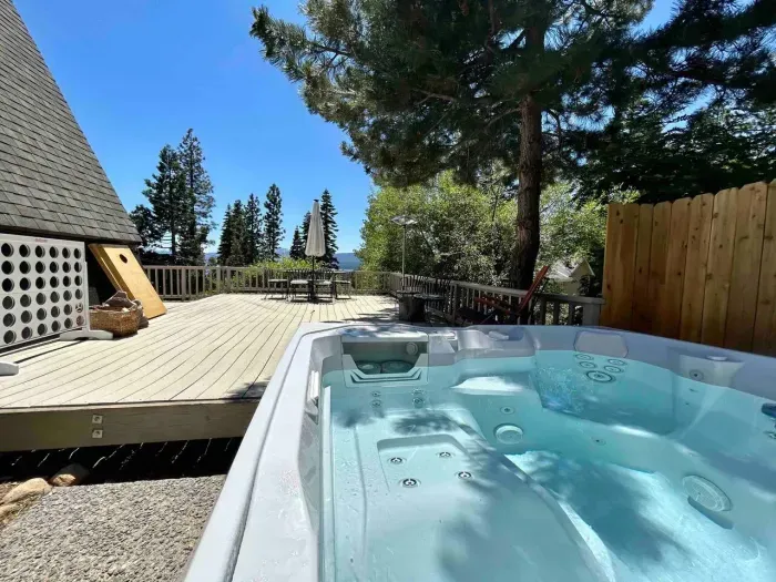 Enjoy the view towards the forest and Lake Tahoe from our Salt Water Spa! Just steps from the main living area-we provide the spa towels 