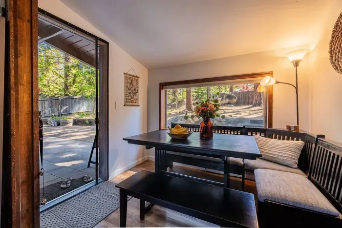 Dine in our cozy breakfast nook with views into the shaded backyard. We also have additional dining options and patio furniture outside!