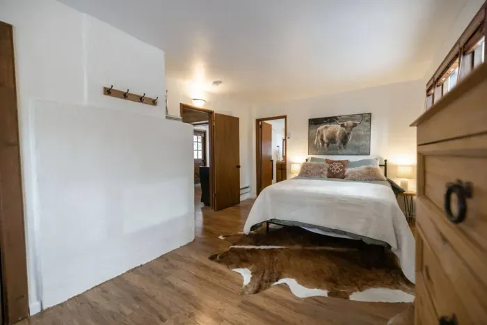 Bedroom #1: The Primary bedroom now has a King Sized bed! There's also and en suite bathroom, work area, and direct access to the front yard.