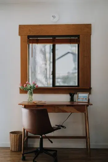 Desk and comfortable chair located in the primary suite