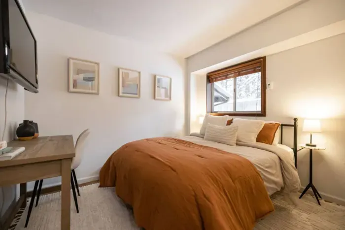 Our third bedroom features a queen bed, desk, and television.