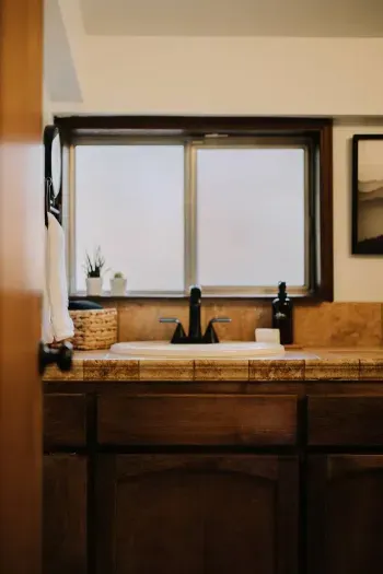 Entrance to the ensuite bath in the primary bedroom. 