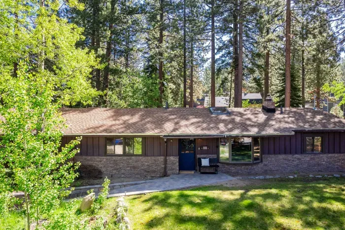 The front view of our home. The Tahoe Retreat is tucked in the pines in a quiet, family neighborhood and has easy access to all of the south shore area. The paving stones leading up to the home are heated making winters a breeze here!