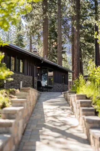 The easy, sloped pathway leads from the driveway and garage up to the front door of The Tahoe Retreat. Bonus for winter! These pavers are heated, meaning that the snow and ice will melt away more easily. 