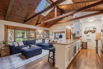 The living area and kitchen gets tons of natural light and is the perfect place to gather your entire group.
