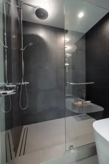 Walk in shower in the primary suite's bathroom