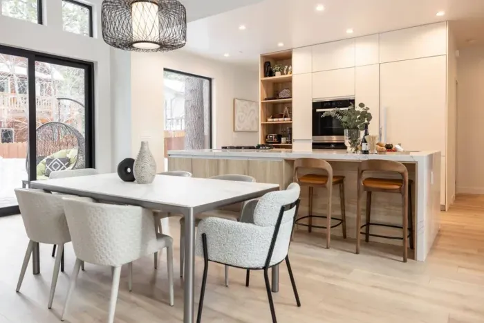 Our dining space has standard seating for 6 (additional chairs available) and is set just off of our chef's kitchen