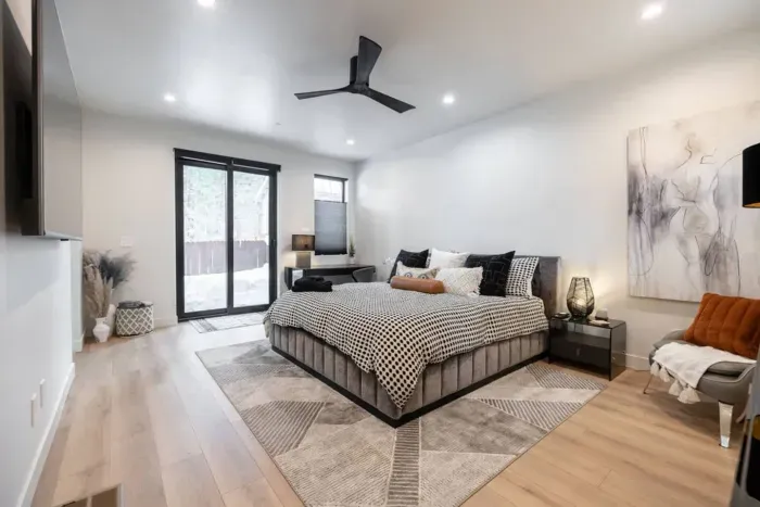 Our primary suite is complete with extra large ensuite bathroom, huge walk-in closet, a work areas, and also features a slider to access a small,  private back deck. 