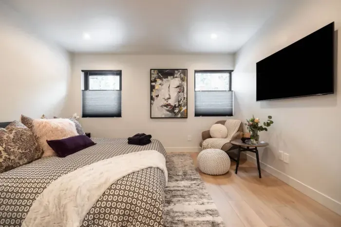 The secondary suite upstairs which features a seating area, large closet and its own ensuite bathroom.