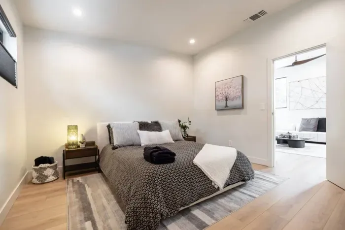 The third bedroom on the upper level is located just to the left of the stairwell