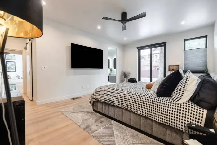 The spacious primary suite is located on the first level. It features a large walk in closet, dedicated work are, flat screen TV and a luxe ensuite bath!