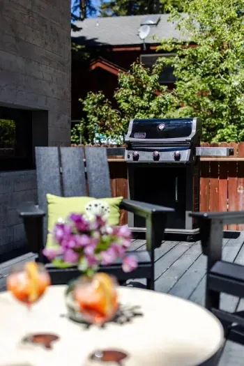 The master BBQ'er can still visit with everyone while preparing a tasty meal on the back patio.