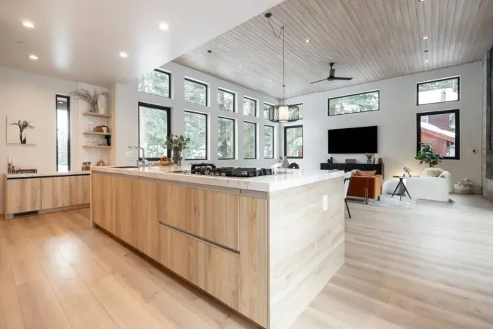 The view of the kitchen looking out into the living room.