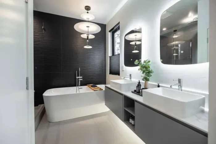 Dual vanity sinks & soaking tub in the primary bedroom ensuite bath, and heated floors for the cold winter days. Separate water closet just to the left.