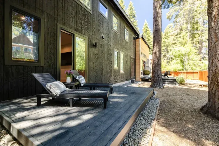 Our primary bedroom also has direct outdoor access via its own private deck, complete with chaise lounges. The main patio deck off in the distance.