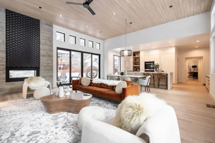 The view of the  spacious living room looking into the open concept dining room and kitchen.
