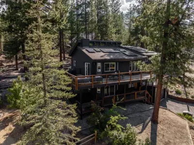 Overview of our home; there are 3 different levels of decks, one fully covered on the lower level. The spa is tucked on the left hand corner of the lower deck.