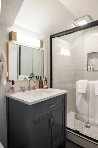 Fully renovated ensuite of the King + Twin room, with new everything plus walk in tiled shower and heated floors!