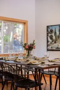 Our dining table comfortably seats 8, with extra chairs and 2 high chairs available onsite. Our kitchen is fully stocked for cooking an amazing meal.