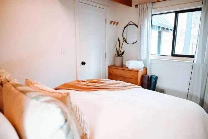 The front bedroom with views out to the forest 