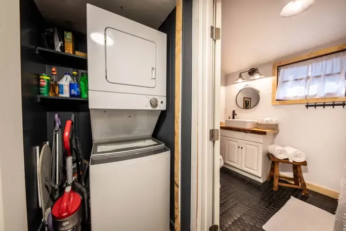 You'll have access to a stacked washer dryer and cleaning supplies, just next to the bathroom