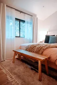 A peak into the back bedroom with queen sized bed
