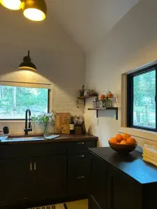 Modern, updated kitchen with plenty of natural light and walnut butcherblock countertops.