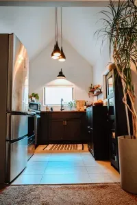 Light and bright galley kitchen with full sized fridge and range, apartment sized dishwasher, microwave and plenty of small appliances.