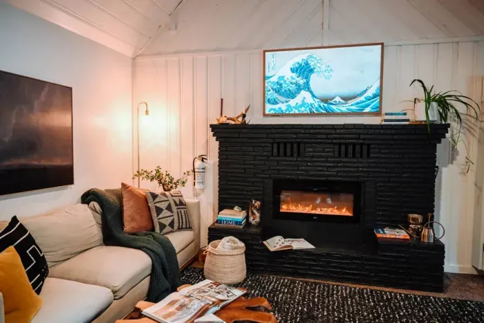 Extra long couch available for perfect lounge days après ski, electric fireplace, and 55" Canvas FrameTV (shown here in in artmode) make the living room one of our favorite places to hang