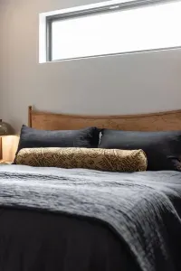Our primary bedroom at The Lake Trail Lodge features a King bed, all new everything, and cotton and linen sheets and duvets from Quince. You'll be sleeping on a cloud!