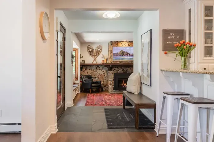Looking into the primary living room from the kitchen fireplace.