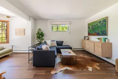 Looking into the secondary living room from the billiards room. This room also has a set of French doors, so if movie time is happening, they can be shut, and the game of billiards can continue!