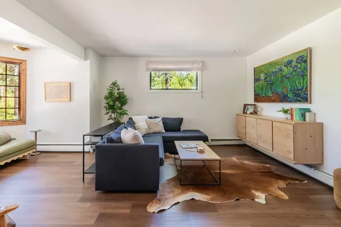 Looking into the secondary living room from the billiards room. This room also has a set of French doors, so if movie time is happening, they can be shut, and the game of billiards can continue!